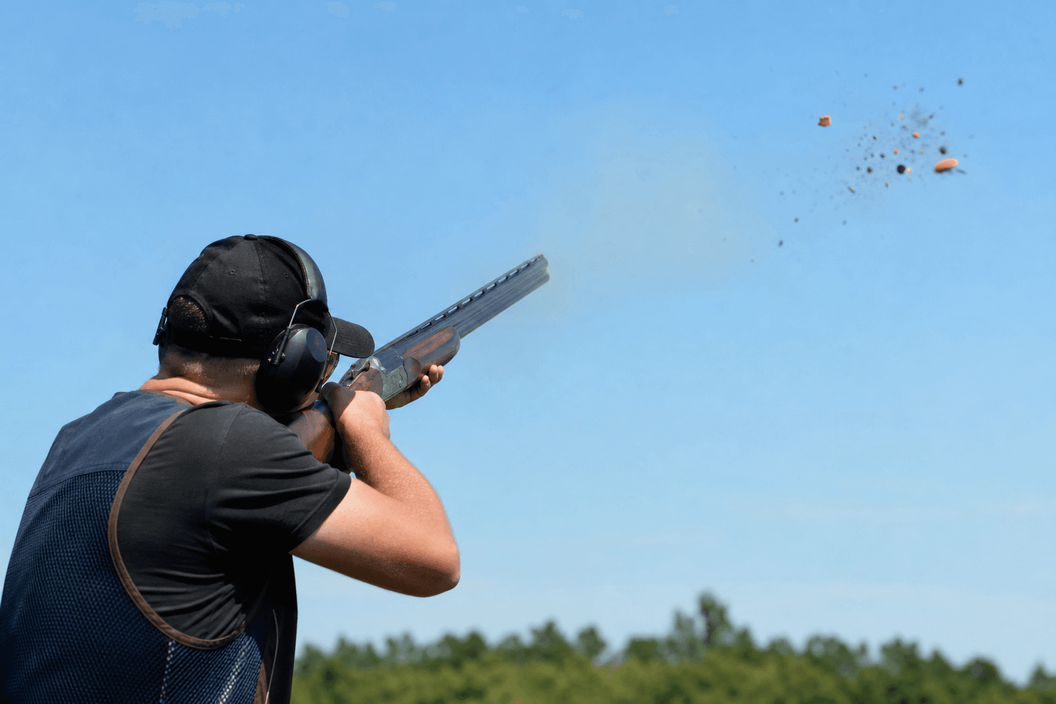 Clay target breaking during trap shooting